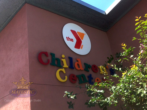 The YMCA Children’s Center utilized bold colors and slanted letter placement to present a fun look for their kids.