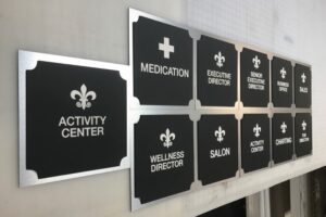 ADA office signs for activity center, wellness director, medication and executive rooms