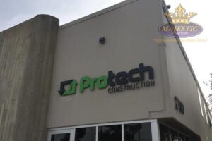 ProTech Construction dimensional building sign installed on a commercial property by Majestic Sign Studio